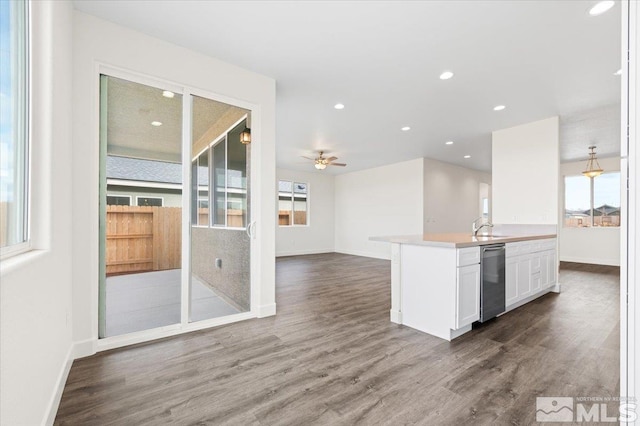 kitchen with sink, white cabinets, dishwasher, ceiling fan, and dark hardwood / wood-style floors