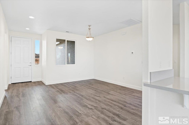 spare room with hardwood / wood-style flooring