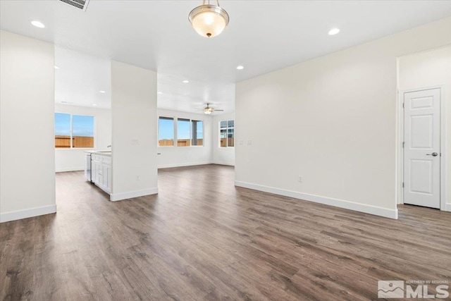 unfurnished living room featuring ceiling fan and wood-type flooring