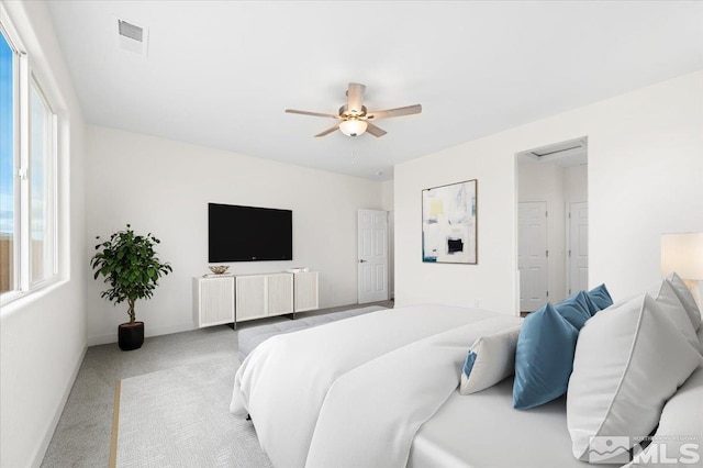 bedroom featuring ceiling fan and light colored carpet