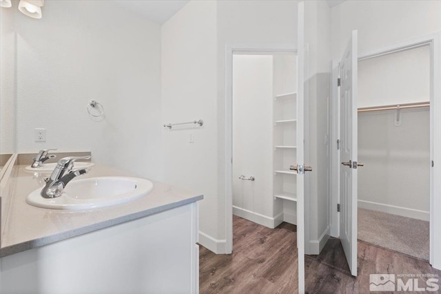 bathroom with wood-type flooring and vanity