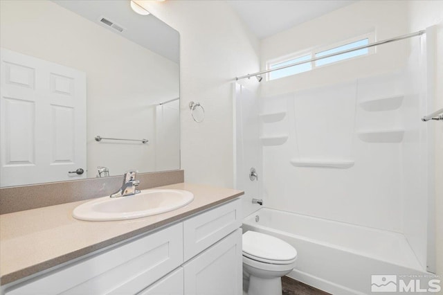 full bathroom featuring shower / washtub combination, vanity, and toilet