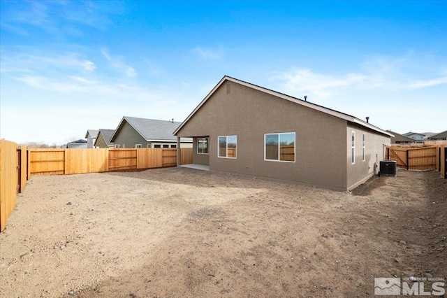 rear view of house with central AC