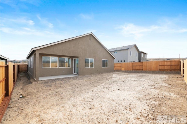 rear view of house featuring a patio area