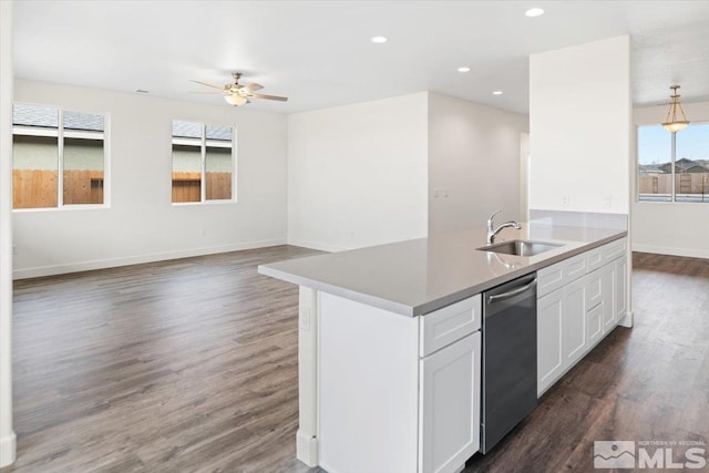 kitchen featuring ceiling fan, dark hardwood / wood-style floors, sink, white cabinetry, and stainless steel dishwasher