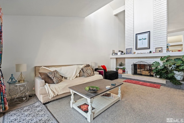 carpeted living room featuring a fireplace