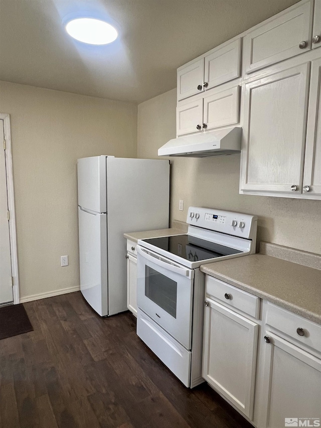 kitchen featuring white appliances, white cabinets, and dark hardwood / wood-style floors