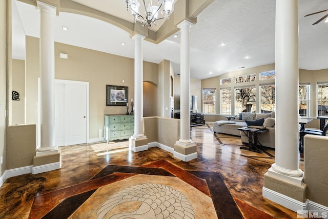 interior space with ceiling fan with notable chandelier and a textured ceiling