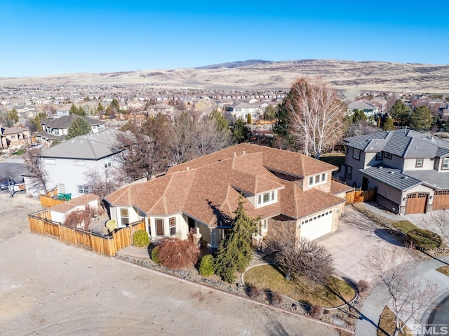 birds eye view of property with a mountain view