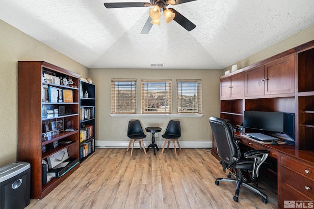 office space with lofted ceiling, baseboard heating, ceiling fan, and light hardwood / wood-style flooring