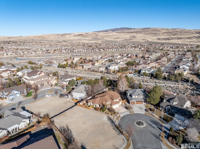 birds eye view of property with a mountain view