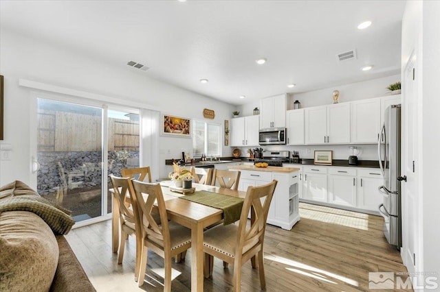 dining room with light hardwood / wood-style floors