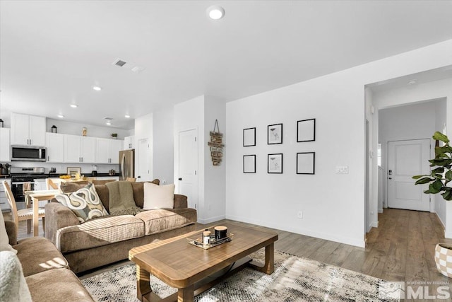 living room featuring light hardwood / wood-style flooring