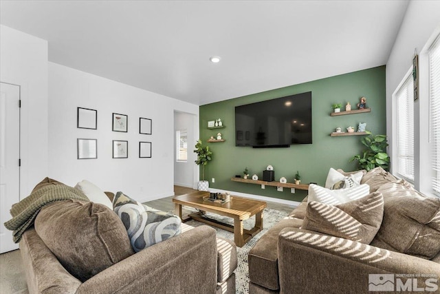 living room with wood-type flooring and a wealth of natural light