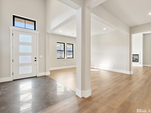 foyer entrance with light hardwood / wood-style flooring