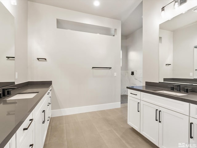 bathroom featuring walk in shower and vanity