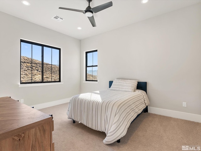 carpeted bedroom with ceiling fan