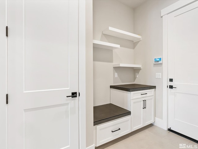 mudroom with light tile patterned floors