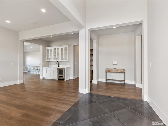 interior space featuring wine cooler and indoor wet bar