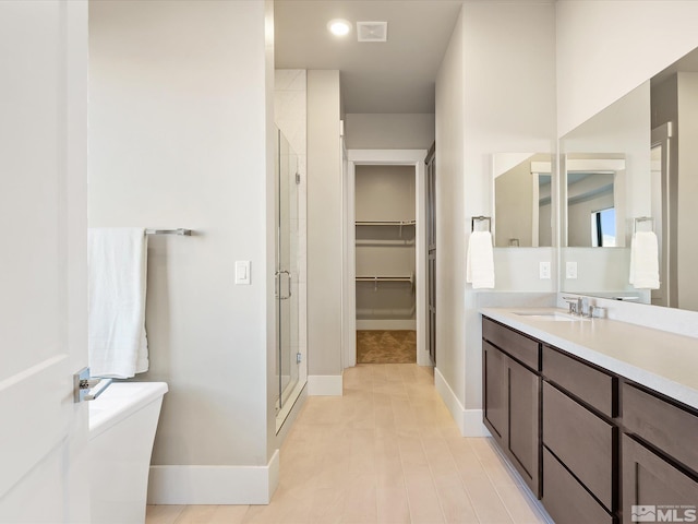 bathroom with an enclosed shower and vanity