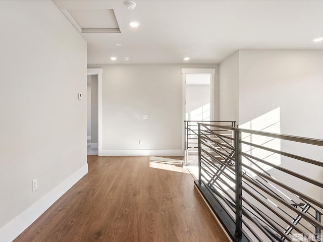 corridor featuring wood-type flooring