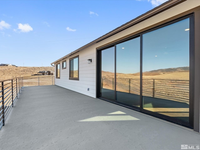 view of patio / terrace with a balcony