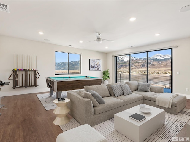 living room featuring ceiling fan, billiards, a mountain view, and hardwood / wood-style flooring