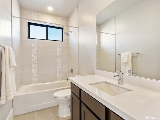 full bathroom with toilet, vanity, tile patterned flooring, and tiled shower / bath