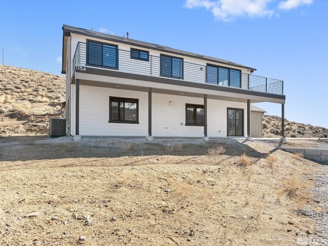 view of front of house featuring central air condition unit