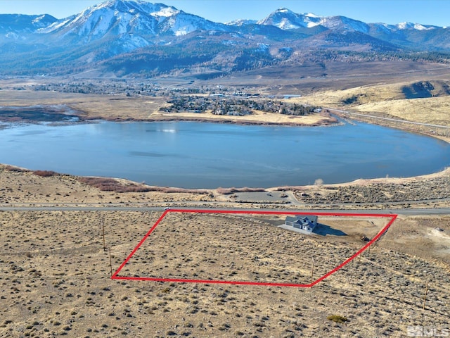 aerial view with a water and mountain view