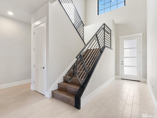 stairway with a towering ceiling