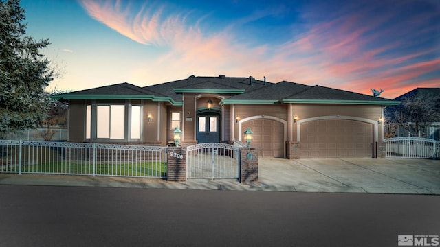 prairie-style house featuring a garage