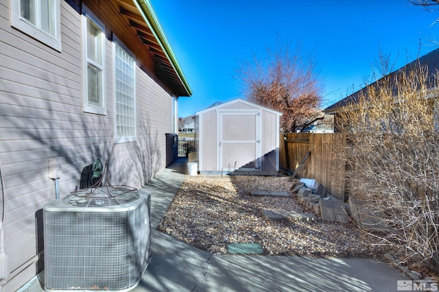 exterior space with central air condition unit and a shed