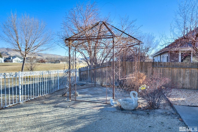 exterior space featuring a gazebo and a mountain view