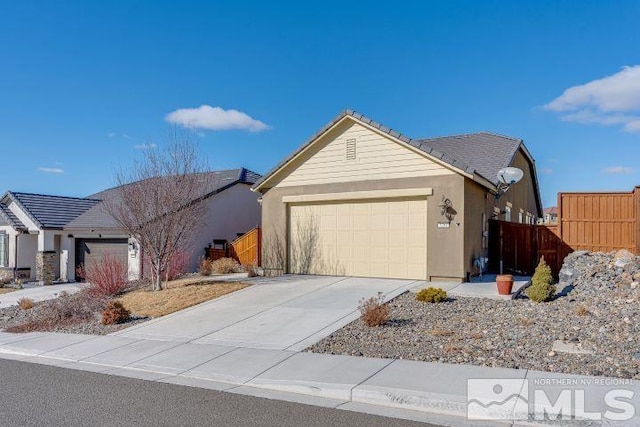 ranch-style house featuring a garage