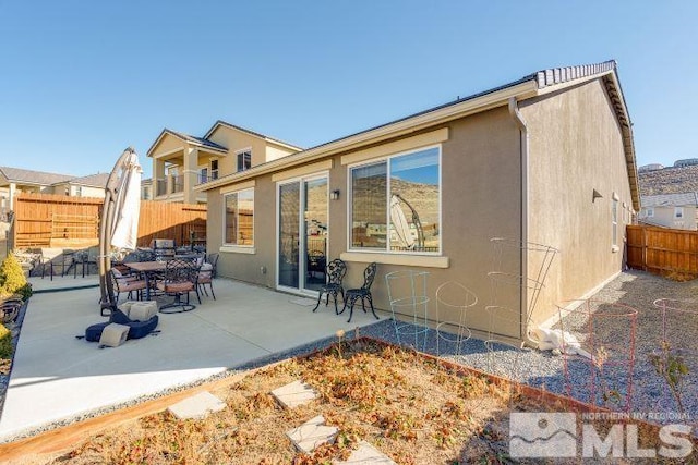 back of house featuring a patio