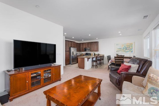 living room featuring light colored carpet