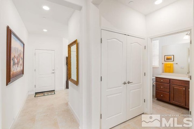 hallway with light tile patterned flooring