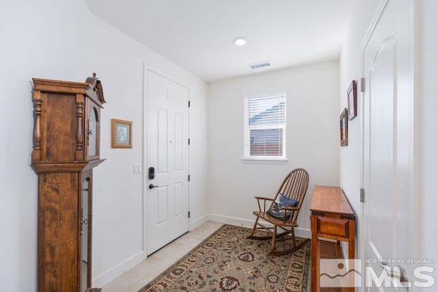 foyer featuring light tile patterned floors