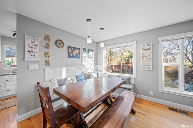 dining space with light wood-type flooring