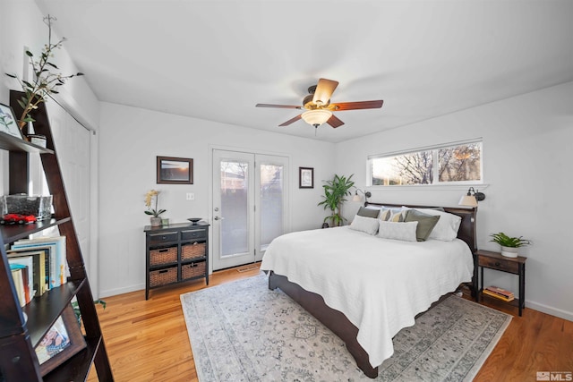 bedroom featuring ceiling fan, access to outside, french doors, and hardwood / wood-style floors