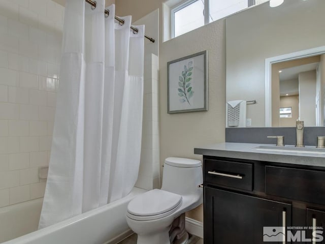 full bathroom with toilet, vanity, and shower / bath combo