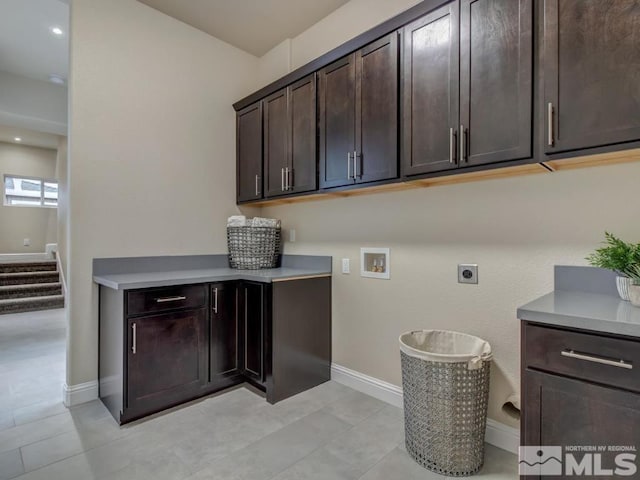 laundry area featuring cabinets, hookup for a washing machine, and hookup for an electric dryer