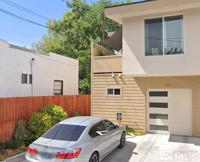 view of property exterior with a garage