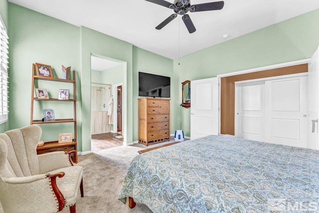 carpeted bedroom featuring ceiling fan, a closet, and connected bathroom