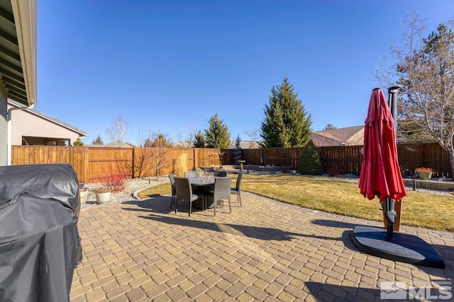 view of patio featuring a grill