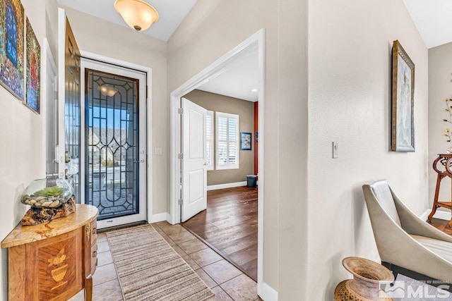 foyer featuring tile patterned floors