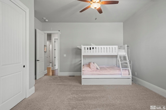 bedroom featuring ceiling fan and carpet floors