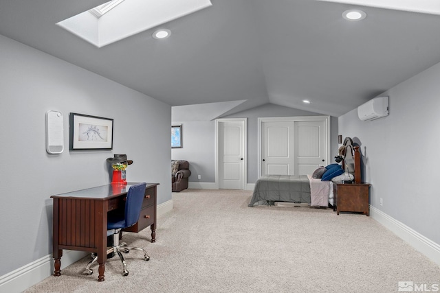 bedroom featuring vaulted ceiling with skylight, light colored carpet, and an AC wall unit