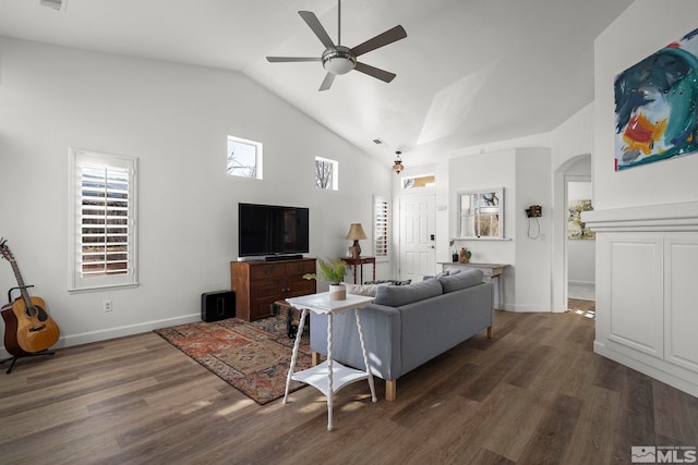 living room featuring ceiling fan, dark wood-type flooring, and high vaulted ceiling